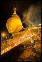 Offerings to the Buddha continues throughout the night at the Golden Rock. Kyaiktiyo, Myanmar ( color)