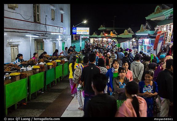 Food vendors and souvenir shops at night, Potemkin village. Kyaiktiyo, Myanmar (color)