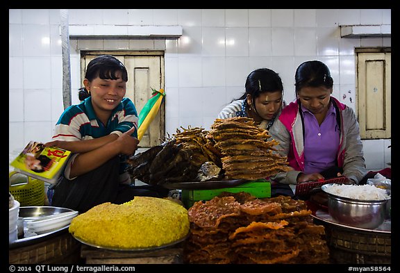 Food vendors reading, Potemkin village. Kyaiktiyo, Myanmar (color)