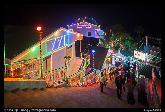 Colorfully lit guesthouses for Burmese people. Kyaiktiyo, Myanmar (color)