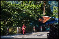 Monk walking barefoot on the path to the Golden Rock. Kyaiktiyo, Myanmar ( color)