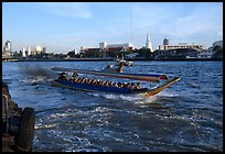 Crowded long tail taxi boat on Chao Phraya river. Bangkok, Thailand