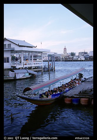 Evening commute, long tail taxi boat on Chao Phraya river. Bangkok, Thailand