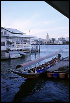 Evening commute, long tail taxi boat on Chao Phraya river. Bangkok, Thailand