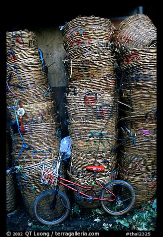 Bicycle and baskets near market. Bangkok, Thailand (color)