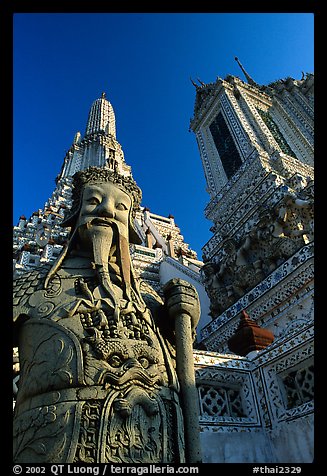 Statue and tower, Wat Arun. Bangkok, Thailand
