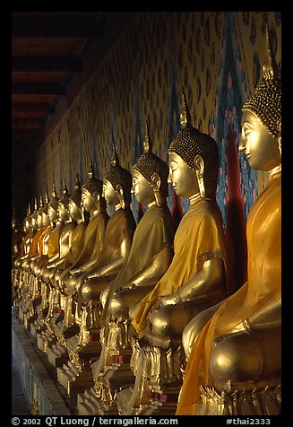 Row of Buddha statues in gallery, Wat Arun. Bangkok, Thailand