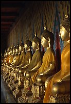 Row of Buddha statues in gallery, Wat Arun. Bangkok, Thailand ( color)