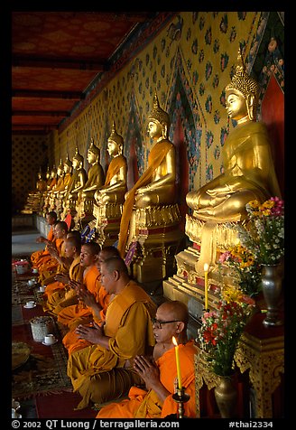 Buddhist monks and buddha statues, Wat Arun. Bangkok, Thailand (color)