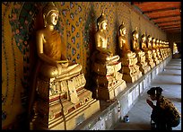 Woman worships a buddha image, Wat Arun. Bangkok, Thailand ( color)