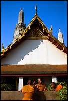 Monks outside Wat Arun. Bangkok, Thailand