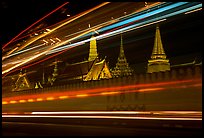 Wat Phra Kaew seen through the lights of traffic. Bangkok, Thailand