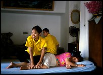 Traditional thai massage in traditional Thai medicine center of Wat Pho. Bangkok, Thailand