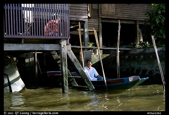 Conversation with neighbor along Thonbury canal. Bangkok, Thailand