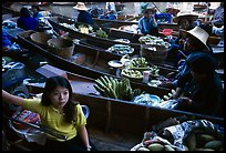 Woman on small boat, floating market. Damonoen Saduak, Thailand (color)