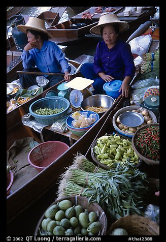 Women selling fruits and vegetables, Floating market. Damnoen Saduak, Thailand (color)