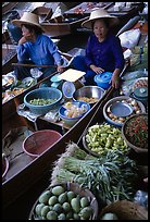 Women selling fruits and vegetables, Floating market. Damonoen Saduak, Thailand (color)