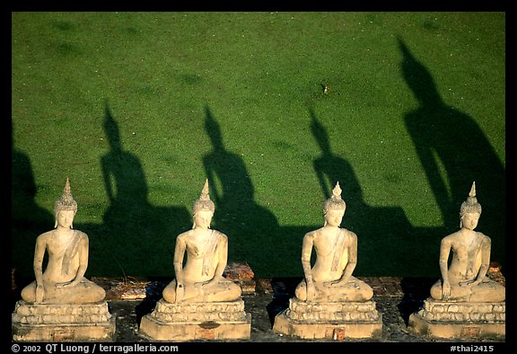 Buddha images and shadows, Wat Chai Mongkon. Ayutthaya, Thailand (color)