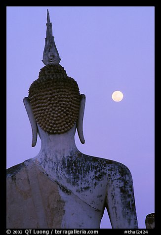 Moon and buddha image at dusk, Wat Mahathat. Sukothai, Thailand (color)