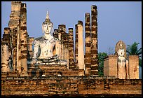 Columns and Buddha statue, Wat Mahathat. Sukothai, Thailand (color)