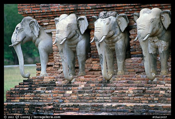 Some of the 36 elephants at the base of Wat Cahang Lom. Sukothai, Thailand