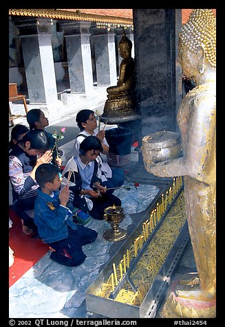 Worshipers at Wat Phra That Doi Suthep, the North most sacred temple. Chiang Mai, Thailand (color)