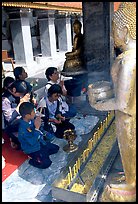 Worshipers at Wat Phra That Doi Suthep, the North most sacred temple. Chiang Mai, Thailand