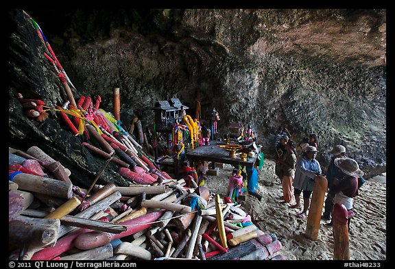 Locals worship at Pranang Cave, Railay. Krabi Province, Thailand (color)