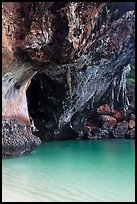 Limestone overhang and turquoise waters, Rai Leh. Krabi Province, Thailand (color)