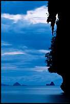 Seascape with limestone islets, stalactite, dusk, Andamam Sea. Krabi Province, Thailand