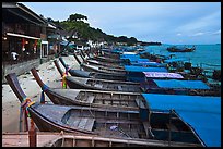 Boats and waterfront houses at dusk Ao Ton Sai, Ko Phi-Phi Don. Krabi Province, Thailand