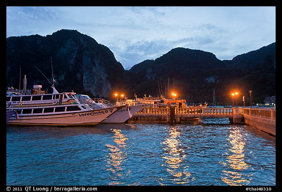 Harbor and cliffs at dusk, Ko Phi-Phi island. Krabi Province, Thailand