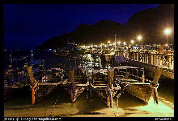 Long tail boats and pier at night, Ko Phi Phi. Krabi Province, Thailand