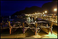 Long tail boats and pier at night, Ko Phi Phi. Krabi Province, Thailand (color)