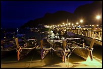 Long tail boats and pier at night, Ko Phi Phi. Krabi Province, Thailand