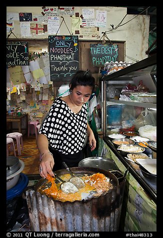 Woman preparing Pad Thai, Phi-Phi island. Krabi Province, Thailand (color)