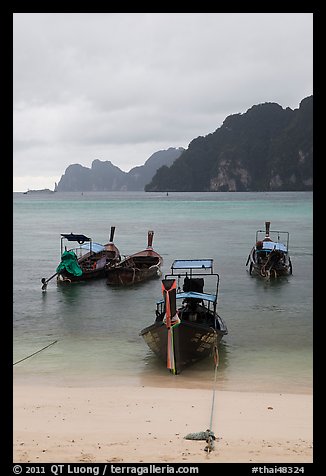 Beach and longtail boats in rainy weather, Ao Ton Sai, Ko Phi Phi. Krabi Province, Thailand