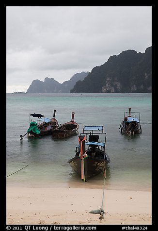 Beach and longtail boats in rainy weather, Ao Ton Sai, Ko Phi Phi. Krabi Province, Thailand (color)