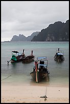 Beach and longtail boats in rainy weather, Ao Ton Sai, Ko Phi Phi. Krabi Province, Thailand