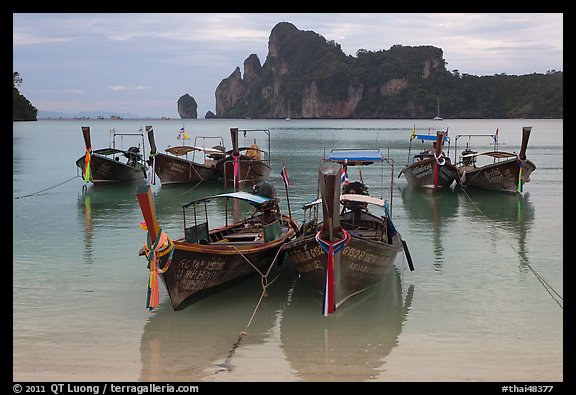 Tranquil waters of Ao Lo Dalam bay with longtail boats, Phi-Phi island. Krabi Province, Thailand (color)