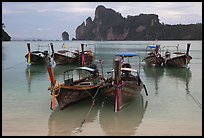 Tranquil waters of Ao Lo Dalam bay with longtail boats, Phi-Phi island. Krabi Province, Thailand