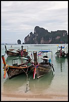 Long tail boats in serene waters of Lo Dalam bay, Ko Phi-Phi island. Krabi Province, Thailand ( color)