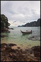 Boat in cove, Ko Phi-Phi island. Krabi Province, Thailand (color)