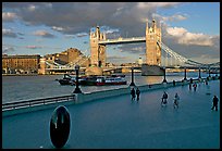 Waterfront promenade in the more London development and Tower Bridge, late afternoon. London, England, United Kingdom