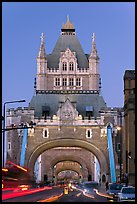 Traffic under arches of the Tower Bridge at twilight. London, England, United Kingdom ( color)