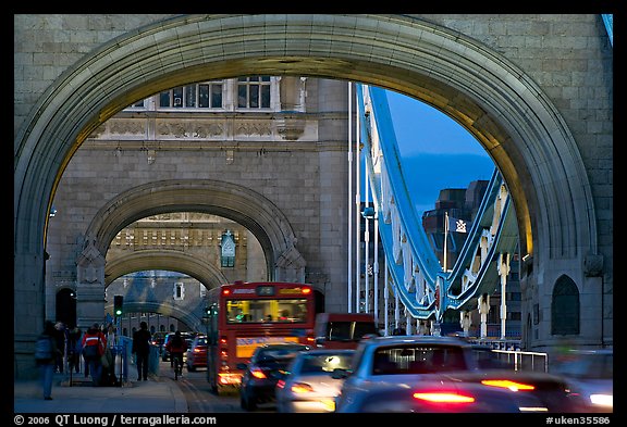 Arches and car traffic on the Tower Bridge at nite. London, England, United Kingdom