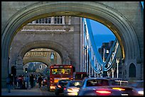 Arches and car traffic on the Tower Bridge at nite. London, England, United Kingdom