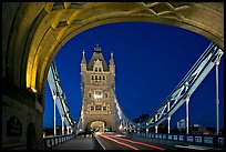 Arch and car traffic on the Tower Bridge at night. London, England, United Kingdom