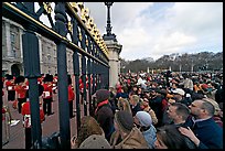 Crowds at the grids in front of Buckingham Palace watching the changing of the guard. London, England, United Kingdom