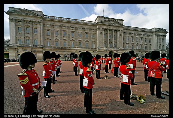 Rows of guards  wearing bearskin hats and red uniforms. London, England, United Kingdom (color)